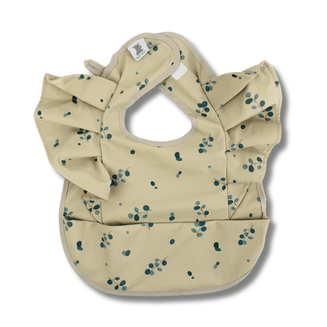 Babero impermeable con volantes y bolsillo recogemigas